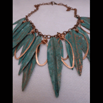 Patinaed copper leaves with hammered copper rings